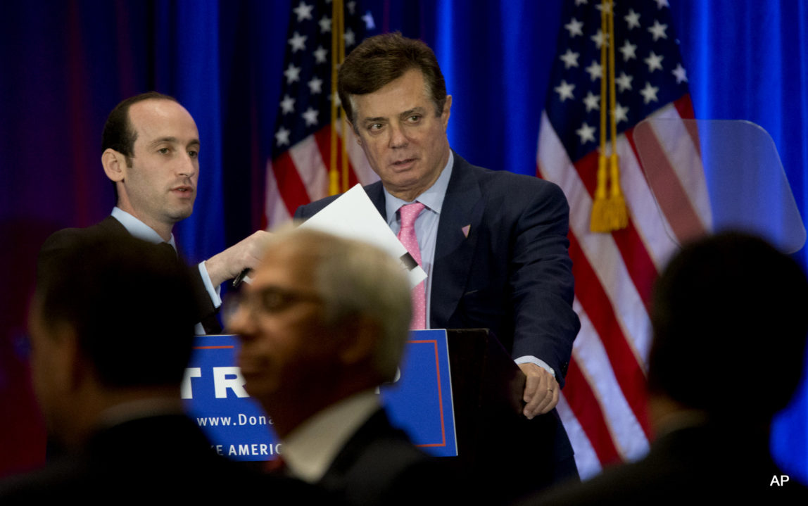 Paul Manafort, right, and Stephen Miller, senior policy adviser for Republican presidential candidate Donald Trump appear on stage ahead of Trump's speech, Wednesday, June 22, 2016, in New York.