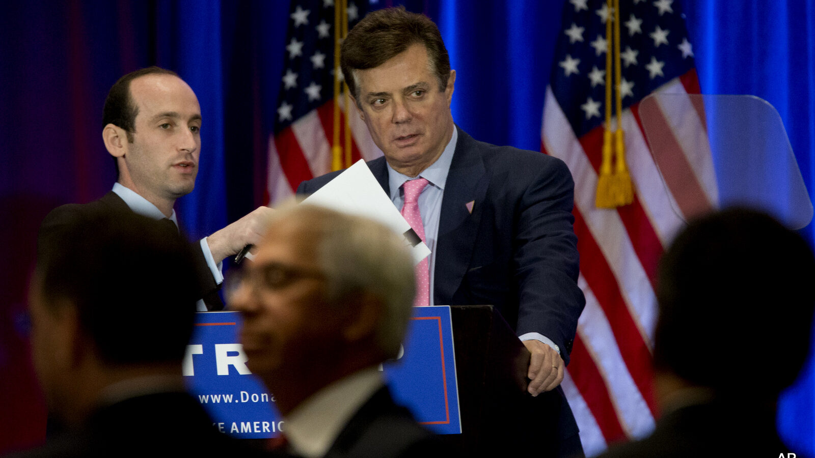 Paul Manafort, right, and Stephen Miller, senior policy adviser for Republican presidential candidate Donald Trump appear on stage ahead of Trump's speech, Wednesday, June 22, 2016, in New York.