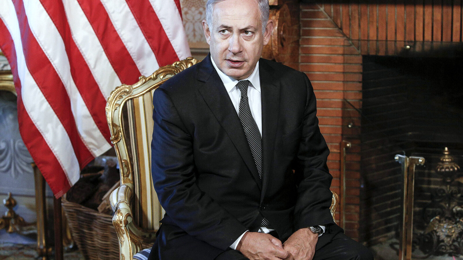 Israeli premier Benjamin Netanyahu sits awaiting his meeting with U.S. Secretary of State John Kerry at Villa Taverna in Rome, Italy, Monday, June 27, 2016.