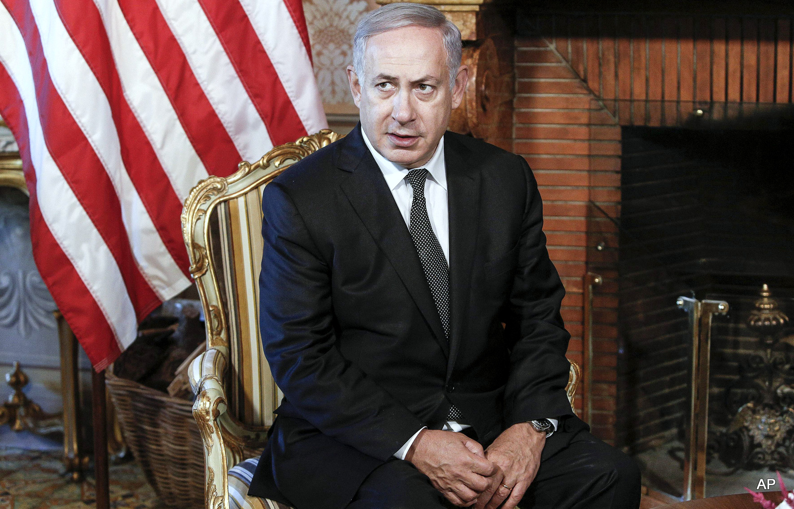 Israeli premier Benjamin Netanyahu sits awaiting his meeting with U.S. Secretary of State John Kerry at Villa Taverna in Rome, Italy, Monday, June 27, 2016.