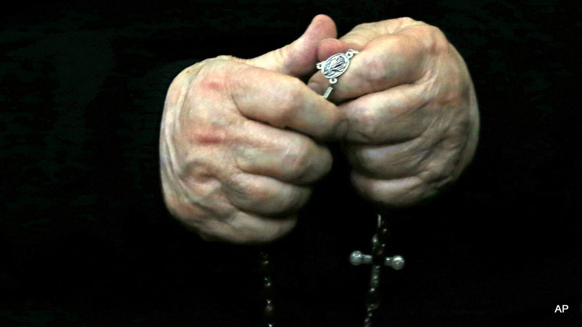 Rev. Fernando Karadima, Chile’s most infamous pedophile priest, holds a rosary in court before testifying in a case that three of his victims brought against the country’s Catholic Church in Santiago, Chile, Wednesday, Nov. 11, 2015.