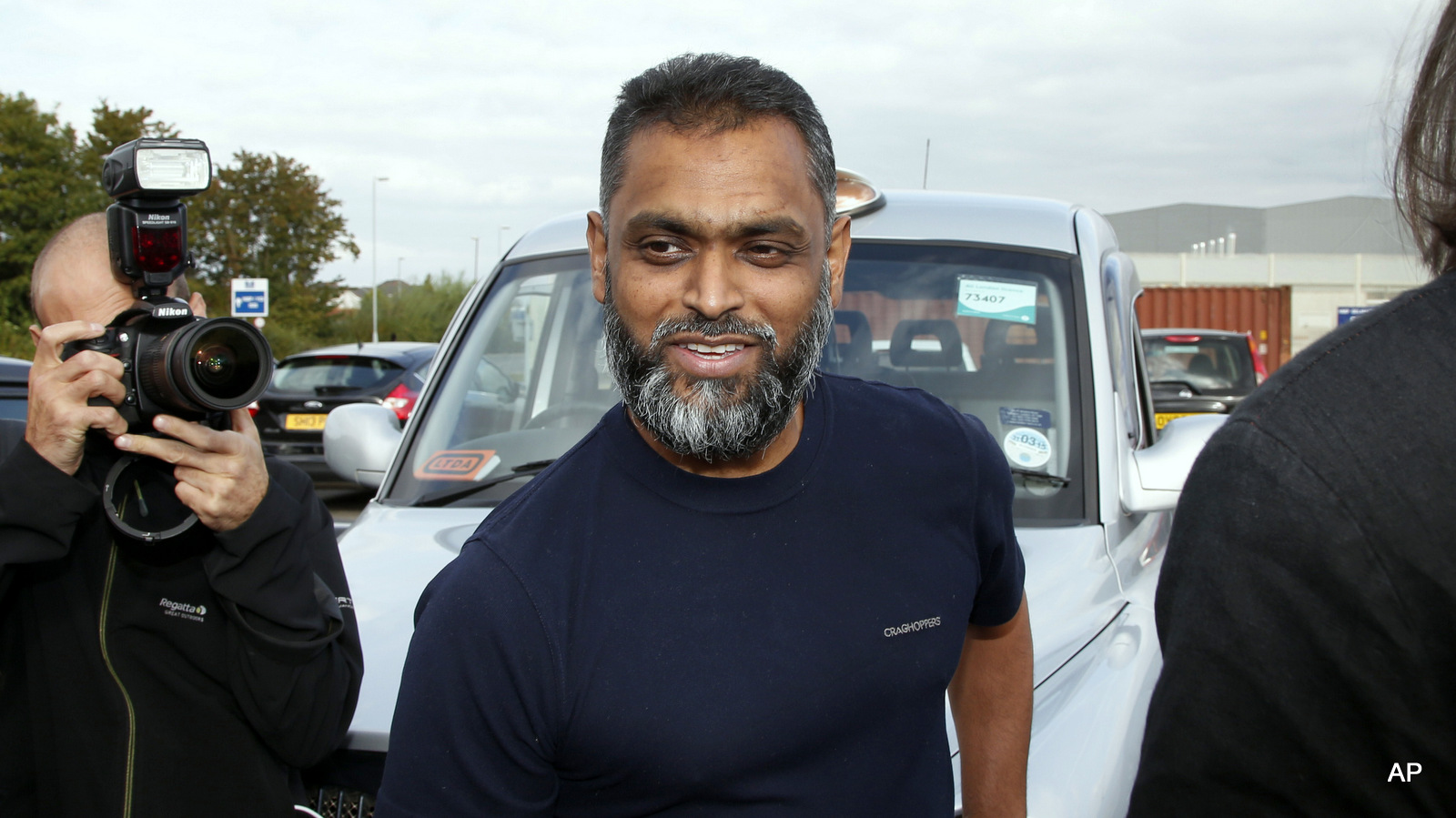 British Moazzam Begg leaves Belmarsh Prison in south London, after his release, Wednesday, Oct. 1, 2014. British prosecutors dropped terrorism charges Wednesday against the former Guantanamo Bay detainee who is a high-profile advocate for the rights of terror suspects.
