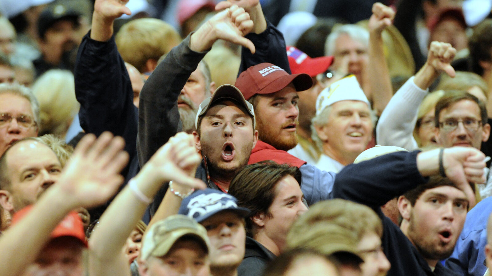 Trump supporters 'boo' the media after a Black Lives Matter protester was removed as Republican presidential candidate Donald Trump spoke during a campaign stop in Birmingham, Ala.