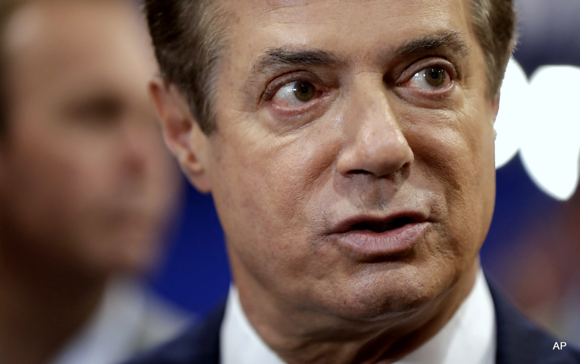 Trump Campaign Chairman Paul Manafort talks to reporters on the floor of the Republican National Convention, Sunday, July 17, 2016.