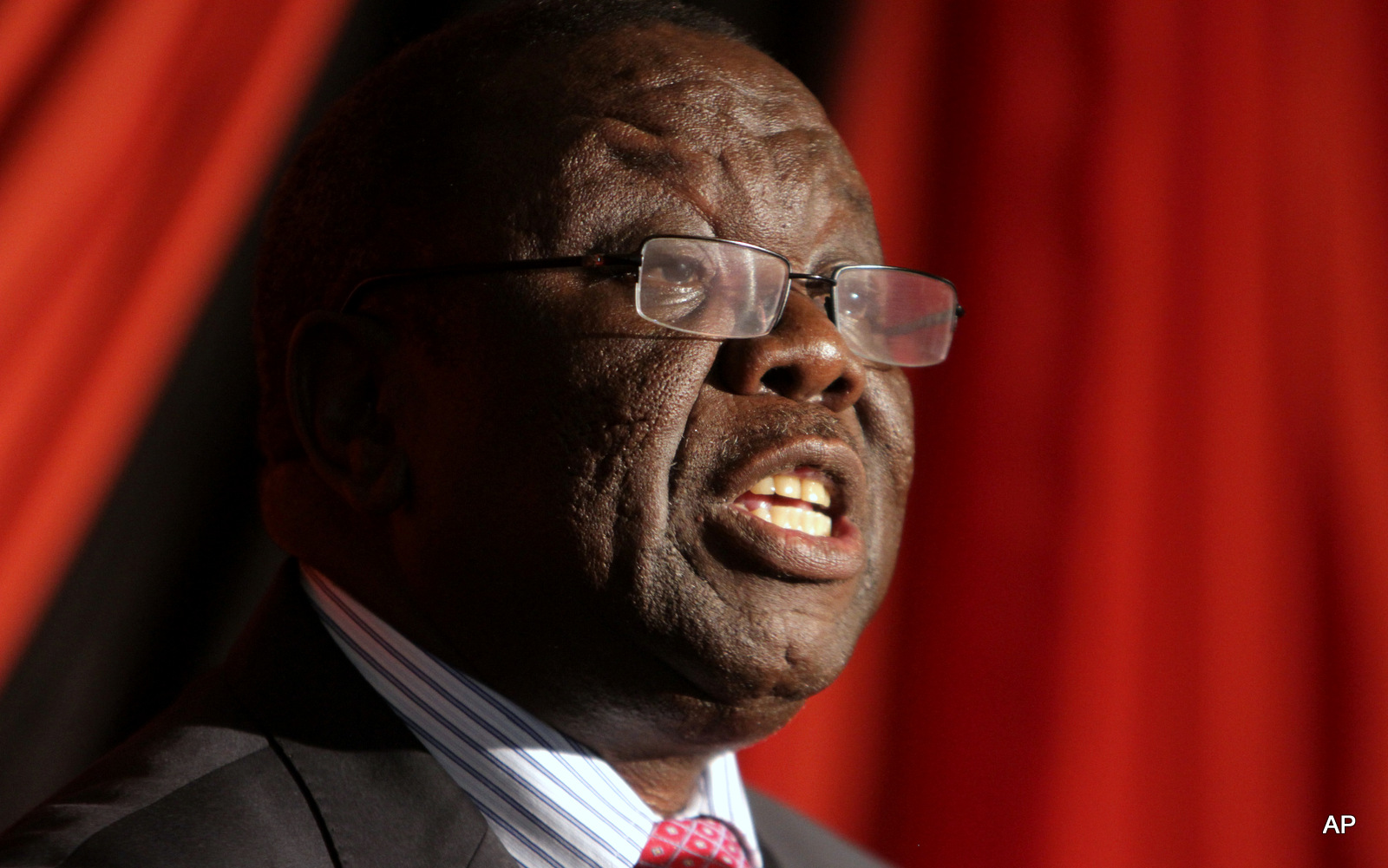 Former Zimbabwe Prime Minister Morgan Tsvangirai delivers his state of the nation address in Harare, Friday, Jan. 24, 2014. 