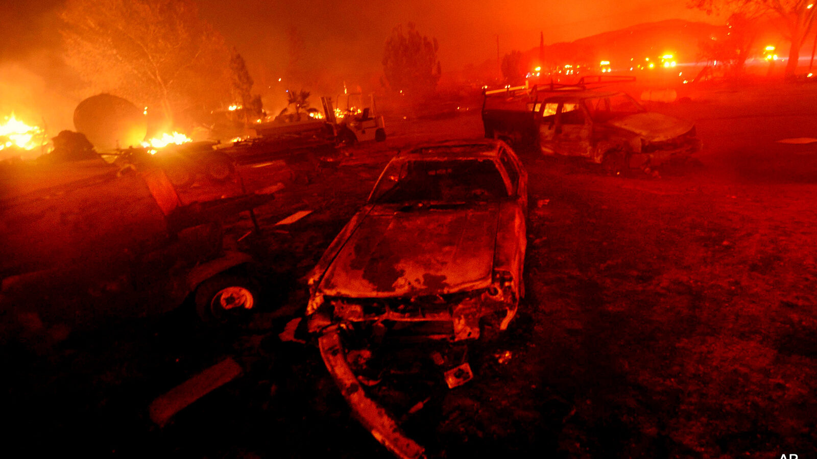 A wildfire burns in the Cajon Pass in San Bernardino county, Calif, Aug. 16, 2016. In addition to record-breaking temperatures, 2016 has also brought more than its fair share of severe weather events, from flooding to fires.