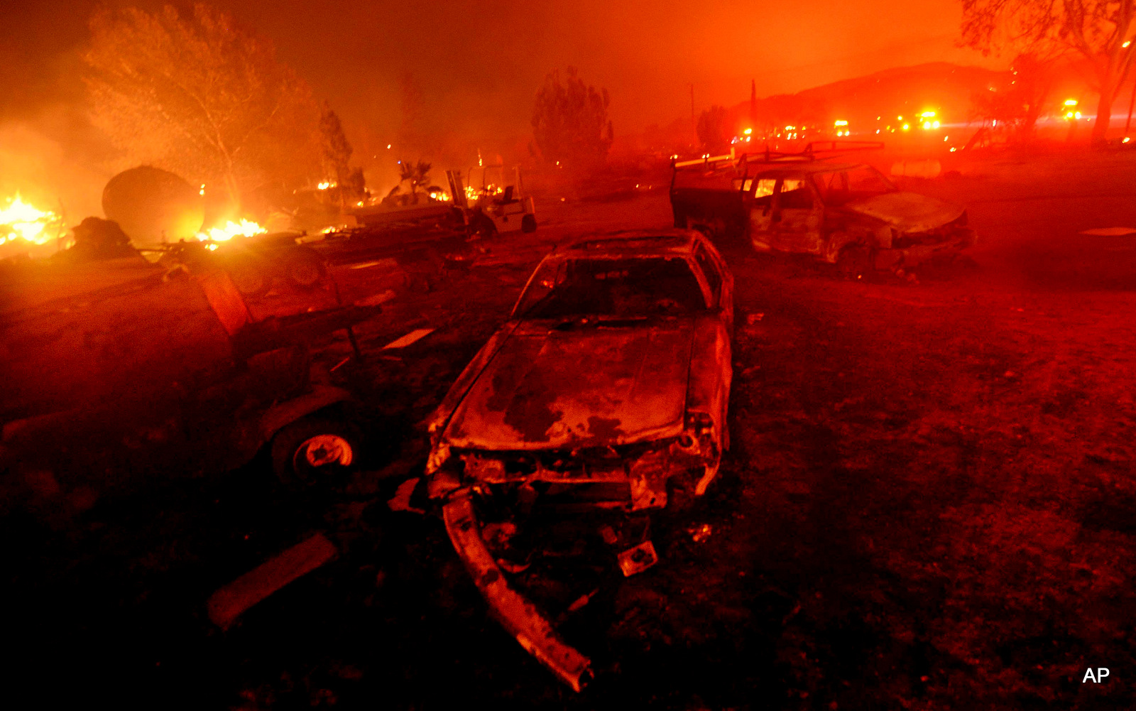 A wildfire burns in the Cajon Pass in San Bernardino county, Calif, Aug. 16, 2016. In addition to record-breaking temperatures, 2016 has also brought more than its fair share of severe weather events, from flooding to fires.