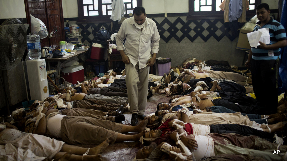 Supporters of ousted President Mohammed Morsi count bodies in a makeshift morgue after police swept into their encampment with armored vehicles and bulldozers in Cairo Wednesday, Aug. 14, 2013. 