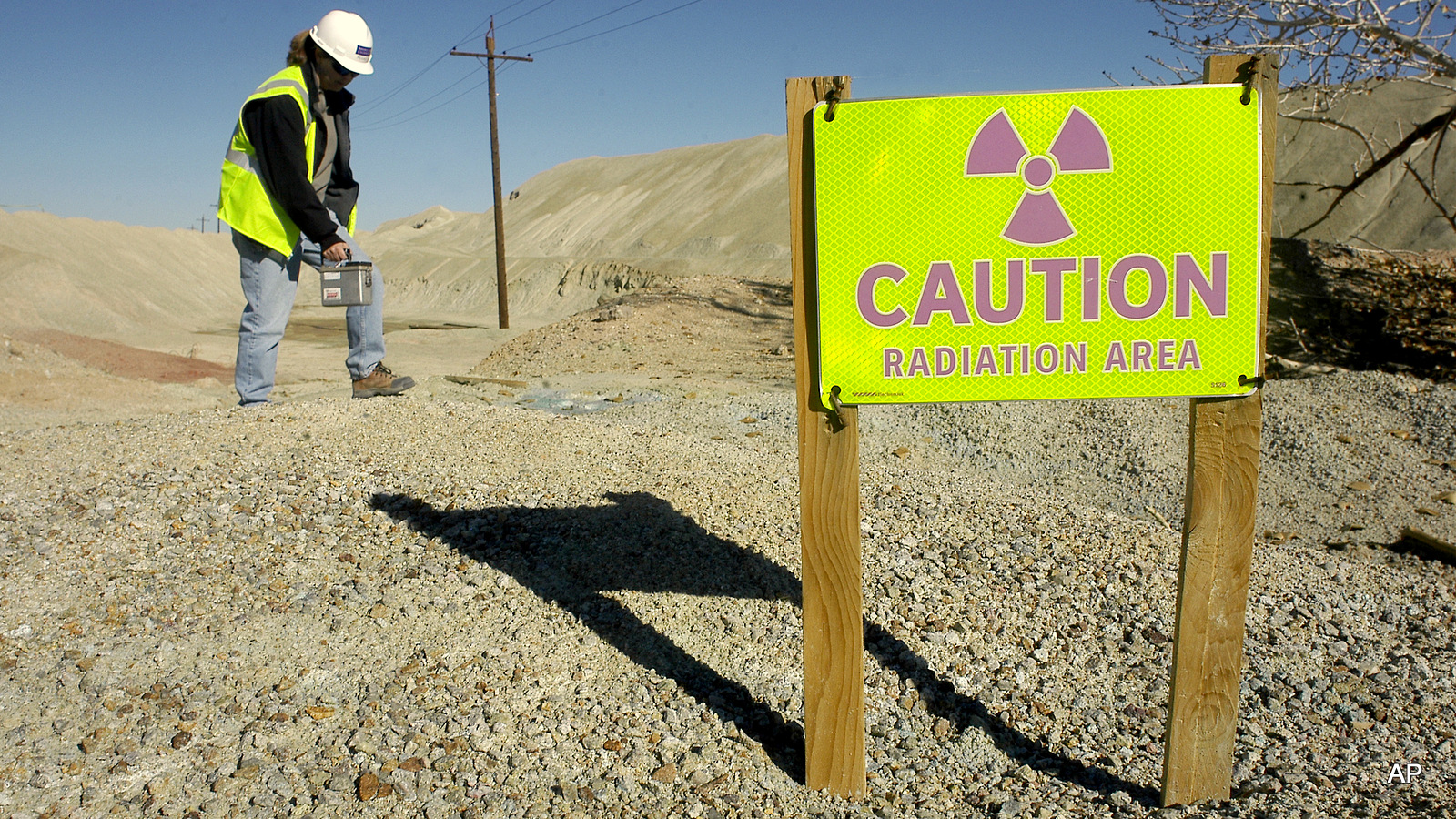 An EPA employee takes a radiation level reading at an abandoned mine in, Nev. After decades of complaints, the EPA has began work to reverse the devastating effects of uranium mine pollution on the Navajo Nation.
