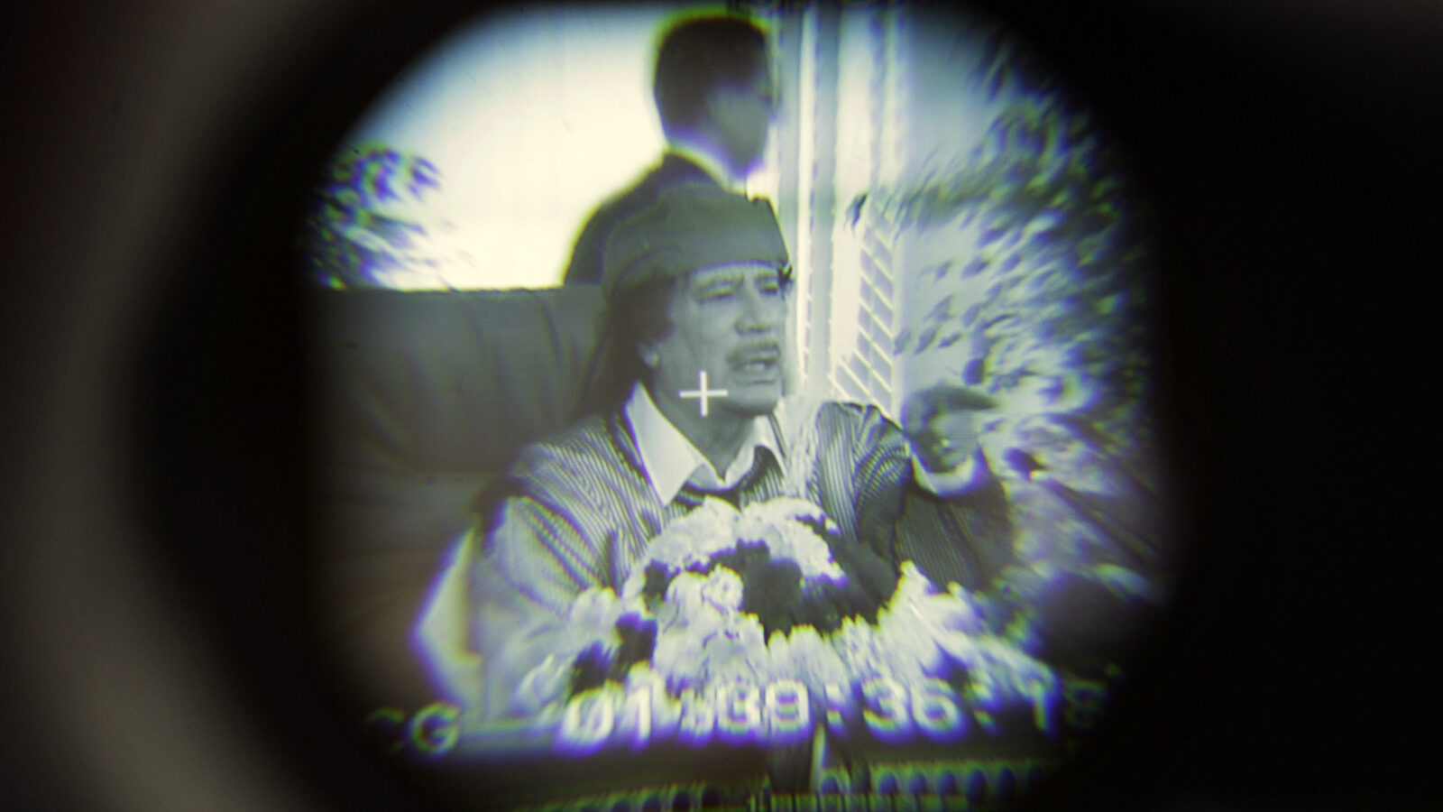 Libyan Leader Moammar Gadhafi is seen through a television camera viewfinder as he speaks in Tripoli, Libya.