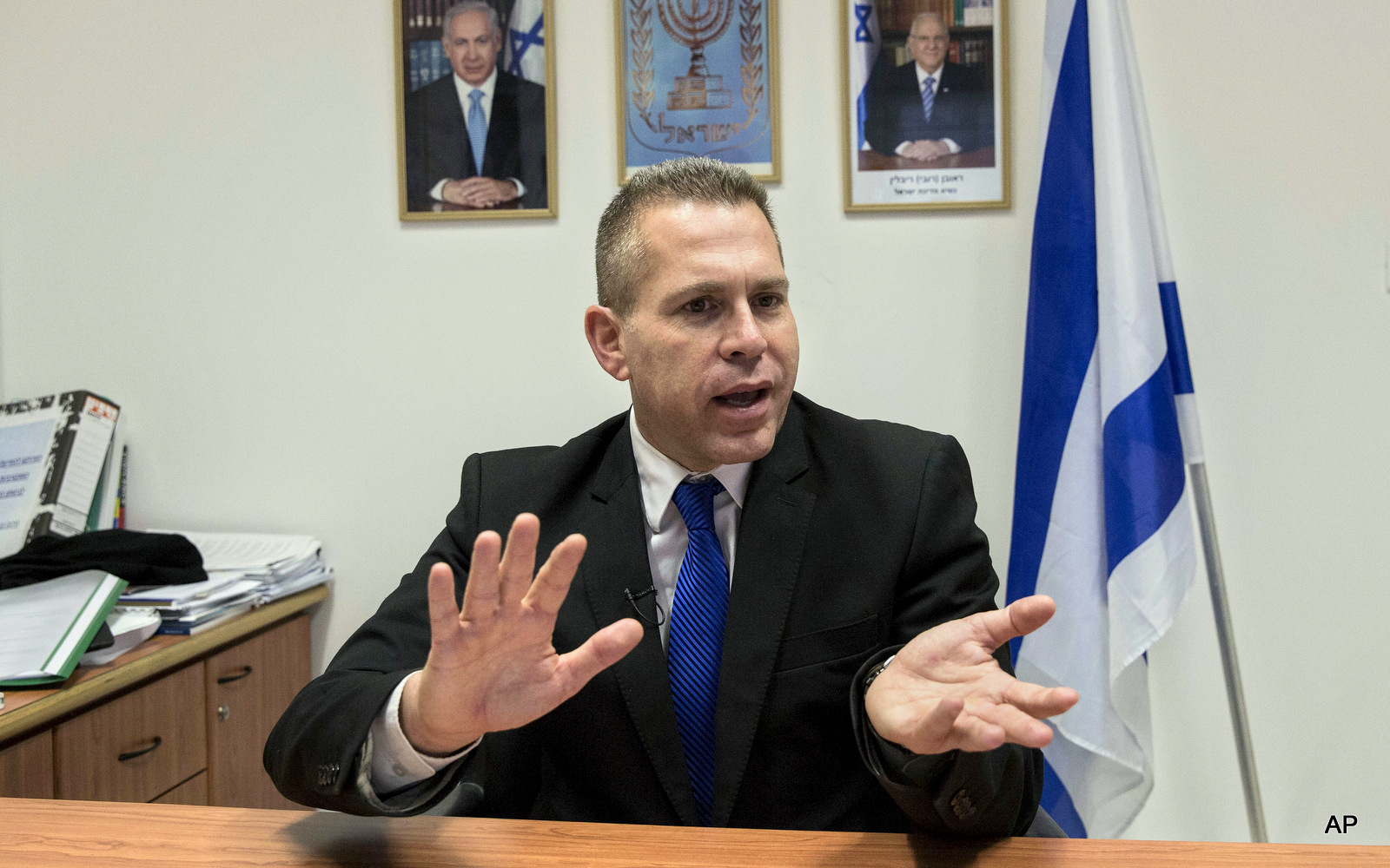 In this Thursday, July 14, 2016 photo, Israeli Public Security Minister Gilad Erdan speaks during an interview with The Associated Press in his office in Tel Aviv, Israel. 