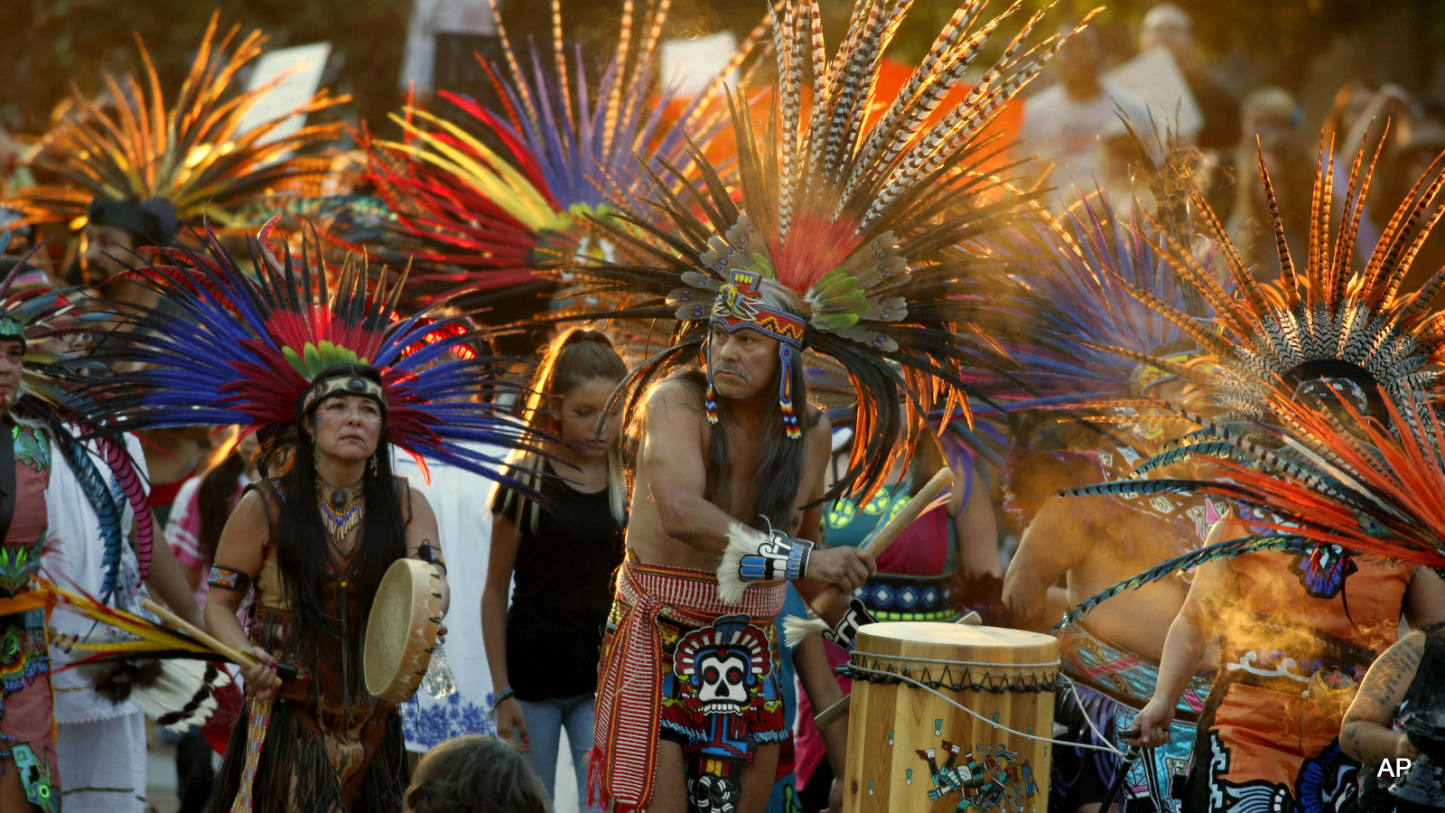 A line of protesters against the construction of the Dakota Access oil pipeline on the Standing Rock Reservation in North Dakota head to a unity rally on the west steps of the State Capitol late Thursday, Sept. 8, 2016, in Denver.