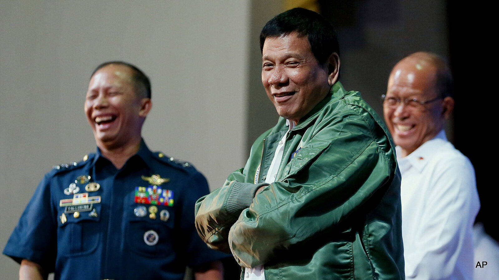 Philippine President Rodrigo Duterte wears a pilot's jacket which was presented to him during his "Talk with the Airmen" on the anniversary of the 250th Presidential Airlift Wing Tuesday, Sept. 13, 2016 at the Philippine Air Force headquarters in suburban Pasay city, southeast of Manila, Philippines.