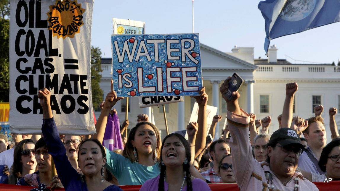 Supporters of the Standing Rock Sioux Tribe rally in opposition of the Dakota Access oil pipeline in front of the White House, Tuesday, Sept. 13, 2016, in Washington.