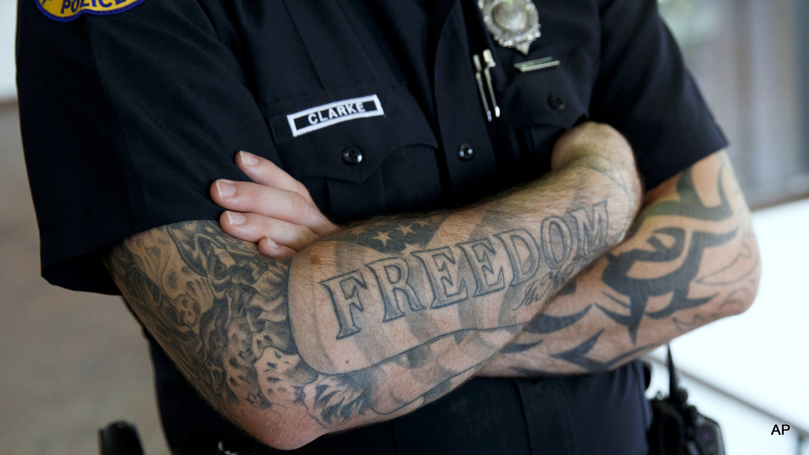 A Miami police officer stands guard during a campaign event with Republican presidential candidate Donald Trump at the James L. Knight Center, Friday, Sept. 16, 2016, in Miami.