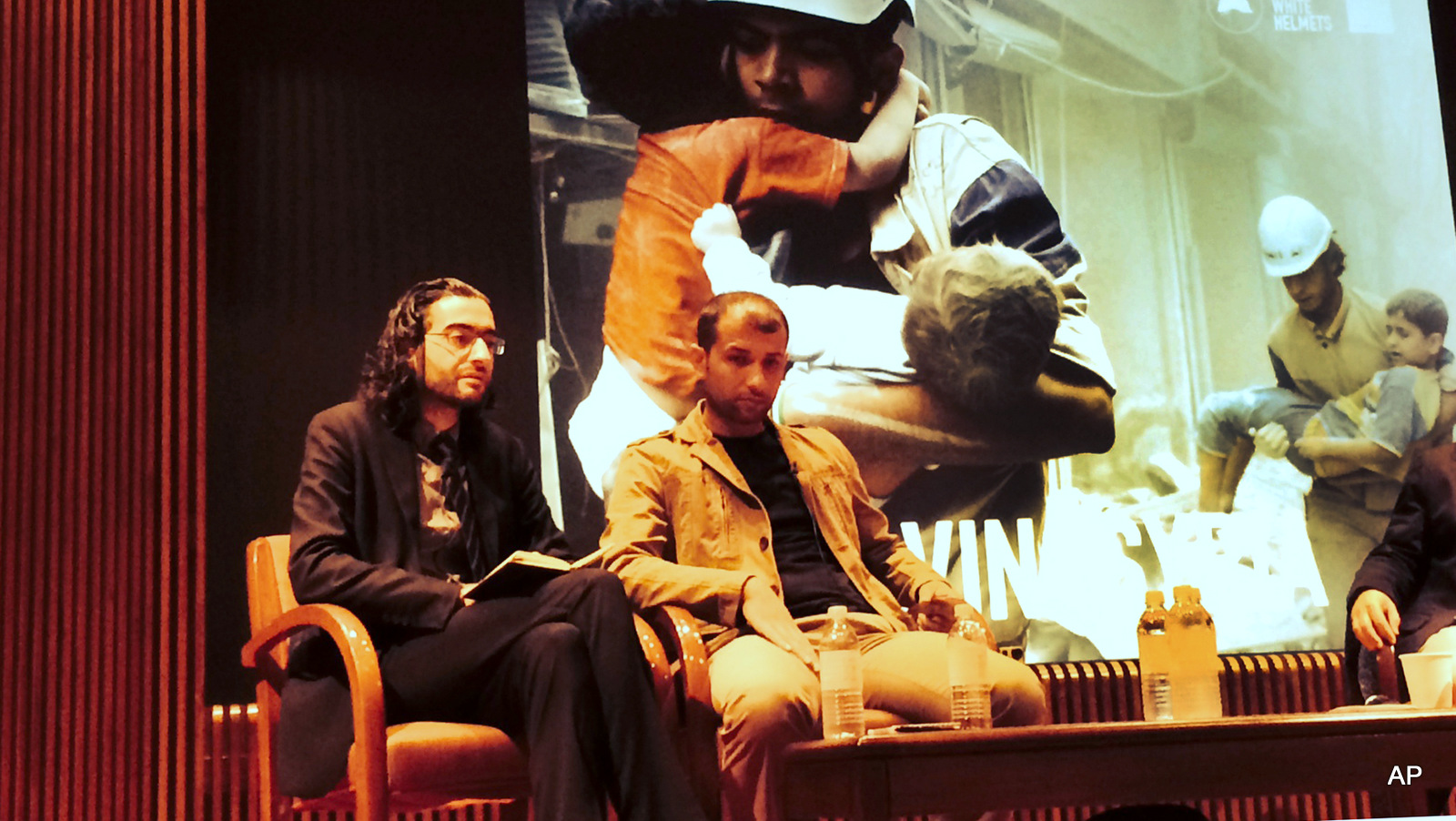 Read Saleh left, the head of the civil defense units in the northern city of Idlib, and Farouk al-Habib, right, a media campaigner for the White Helmets, sit on a panel to draw attention to their work in Syria in midtown New York, September, 2014.