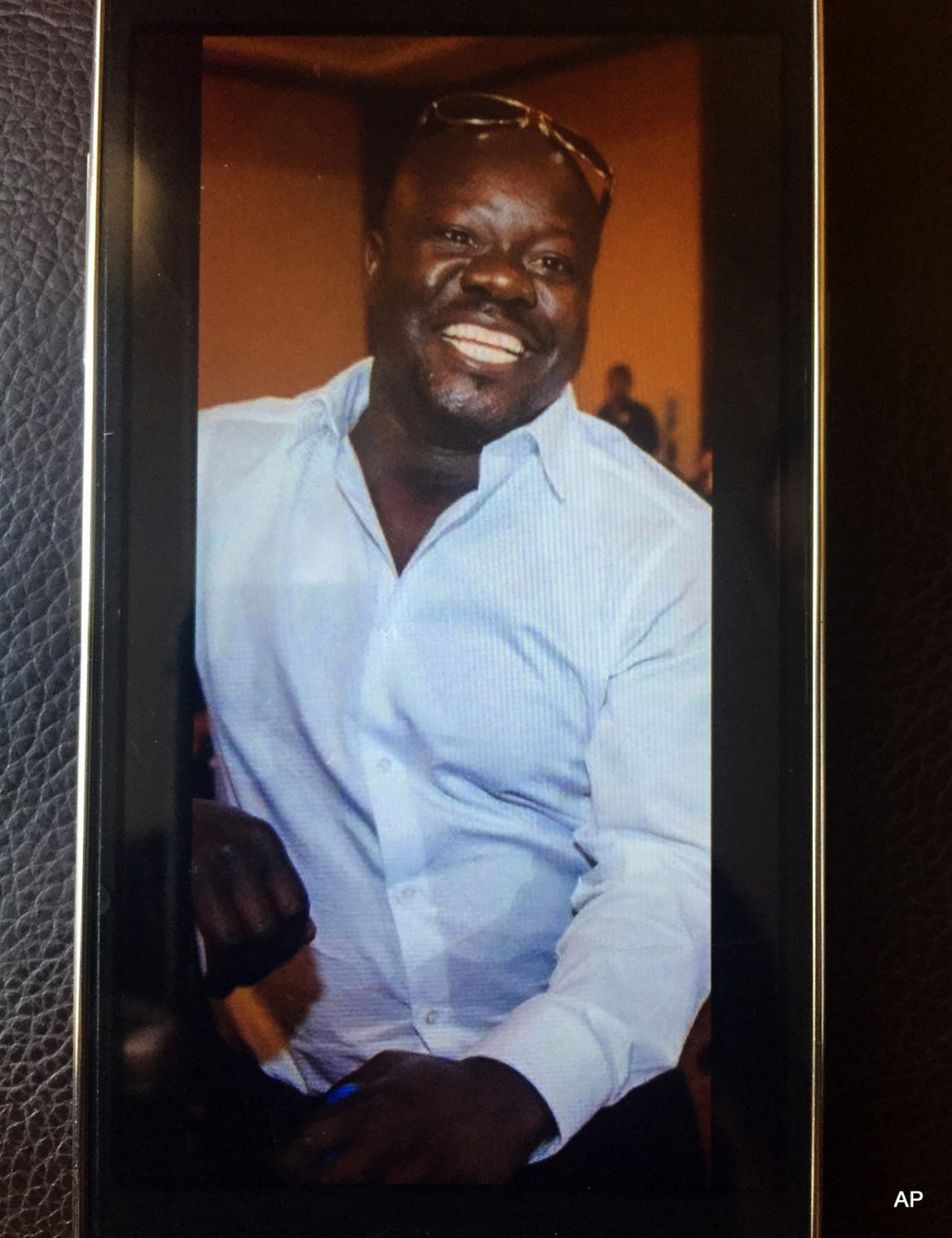 This undated cellphone photo released by Dan Gilleon, the attorney for the family of Alfred Olango, shows Alfred Olango, the Ugandan refugee killed Tuesday, Sept. 27, 2016, in El Cajon, Calif. The fatal police shooting of Olango, who drew something from his pocket and extended his hands in a "shooting stance" happened about a minute after officers in a San Diego suburb arrived at the scene where a mentally unstable man was reportedly walking in traffic, a police spokesman said Wednesday.