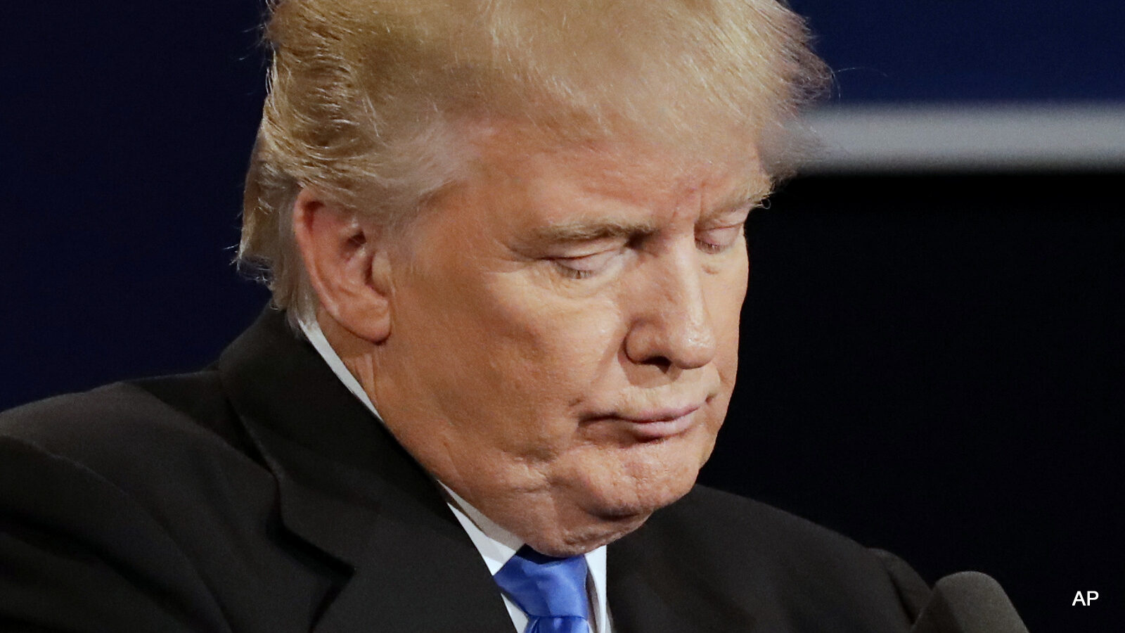 Republican presidential nominee Donald Trump listens to an answer to a question from Democratic presidential nominee Hillary Clinton during the presidential debate at Hofstra University in Hempstead, N.Y.