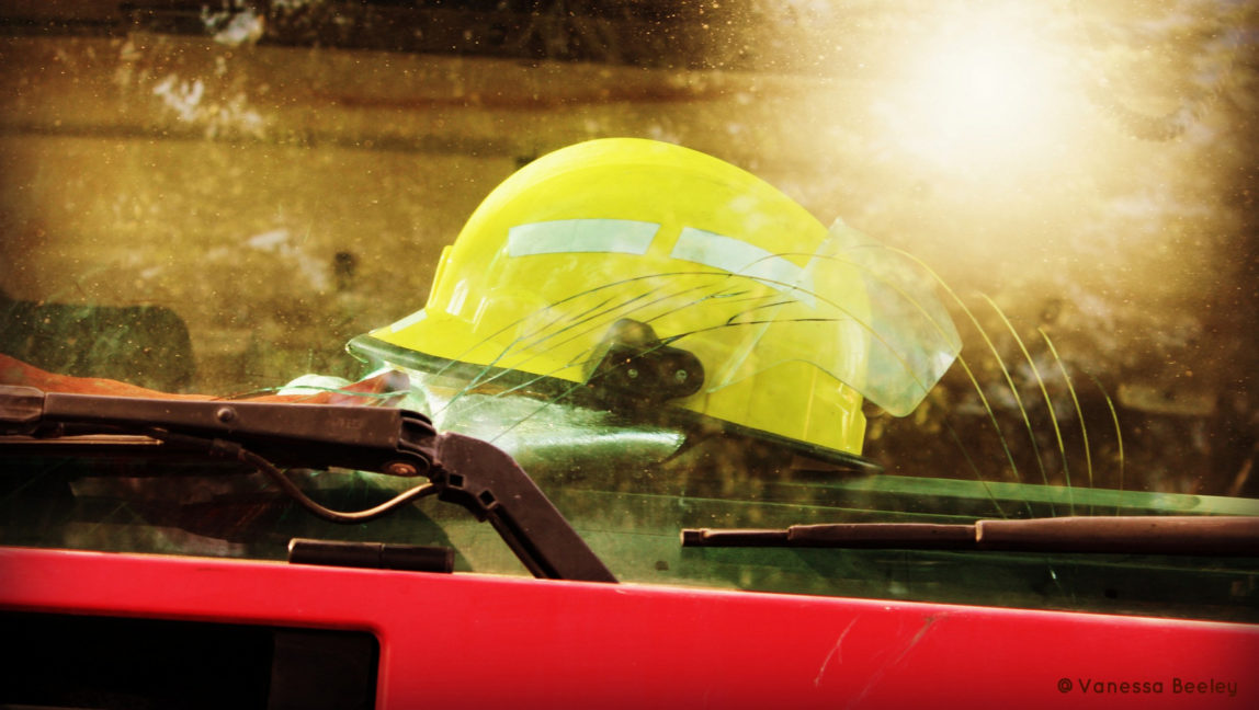 A helmet used by the real Syria Civil Defense is perched on the dashboard, ready for action.  (Photo by Vanessa Beeley)