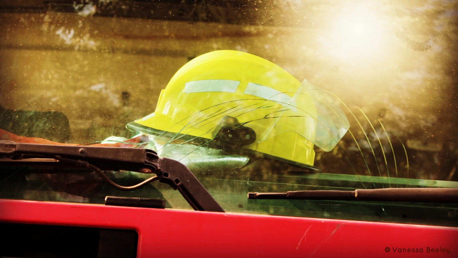 A helmet used by the real Syria Civil Defense is perched on the dashboard, ready for action.  (Photo by Vanessa Beeley)