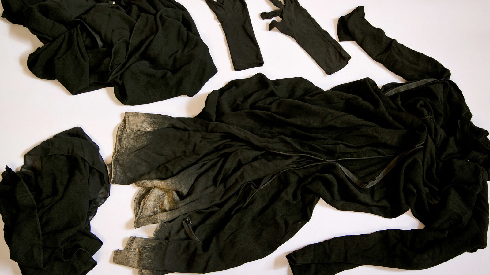 Clothing worn by a Yazidi girl enslaved by ISIS militants, collected by a Yazidi activist to document Islamic State group crimes against the community, shown in this file photo taken May 22, 2016, in Dohuk, northern Iraq.