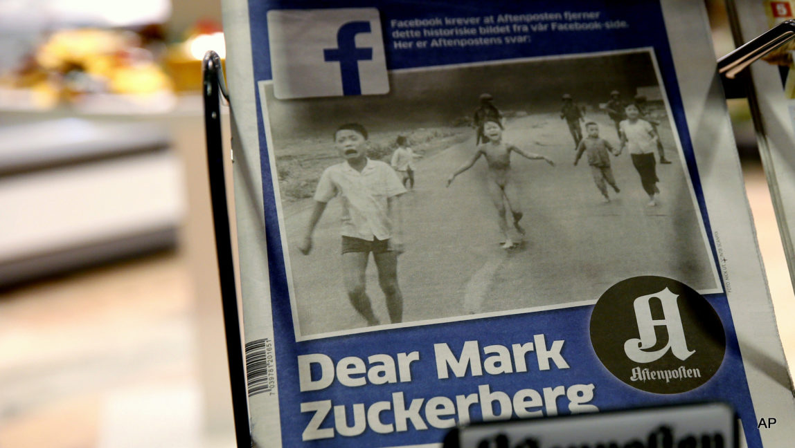 The cover to Norway's largest circulation newspaper, Aftenposten, displayed in Oslo Friday Sept. 9, 2016. Editor-in-chief and CEO, Espen Egil Hansen, wrote an open letter to founder and CEO of Facebook, Mark Zuckerberg, accusing him of threatening the freedom of speech and abusing power after deleting the iconic picture from the Vietnam war, taken by Associated Press photographer Nick Ut, of a young girl running from a napalm attack. The Pulitzer Prize-winning image by Nick Ut is at the center of a heated debate about freedom of speech in Norway after Facebook deleted it from a Norwegian author's page.