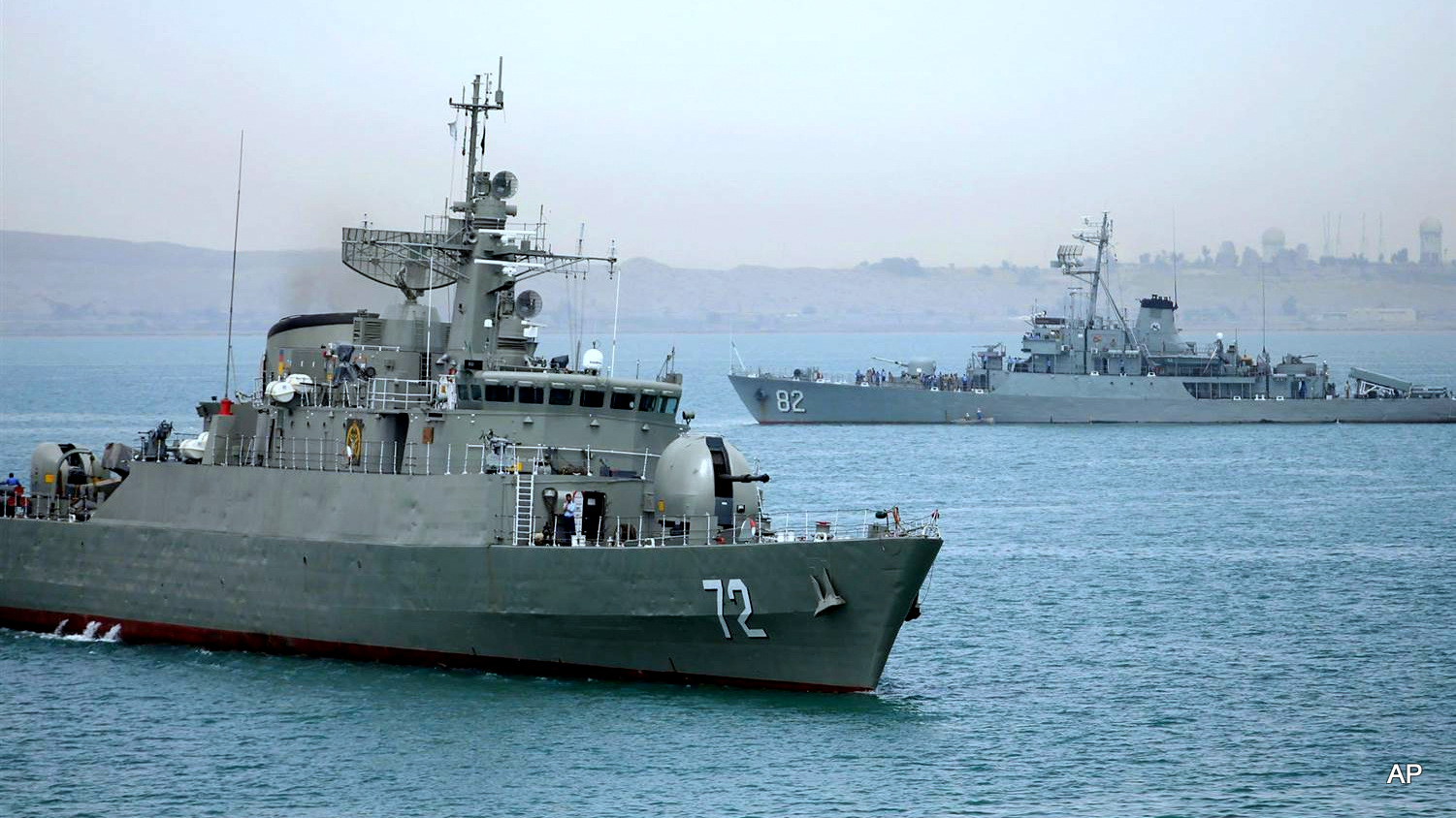 The Iranian warship Alborz, foreground, prepares before leaving Iran's waters on April 7, 2015. Mahdi Marizad / Fars News Agency via AP