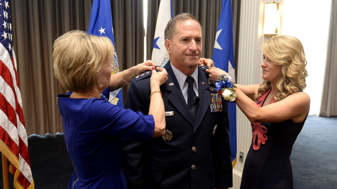 The rank of four-star general is pinned on Air Force Gen. David L. Goldfein by his wife, Dawn, and daughter Diana Glass, during his promotion ceremony, in Washington. D.C., Aug. 6, 2015. (Photo: Scott M. Ash/US Air Froce)