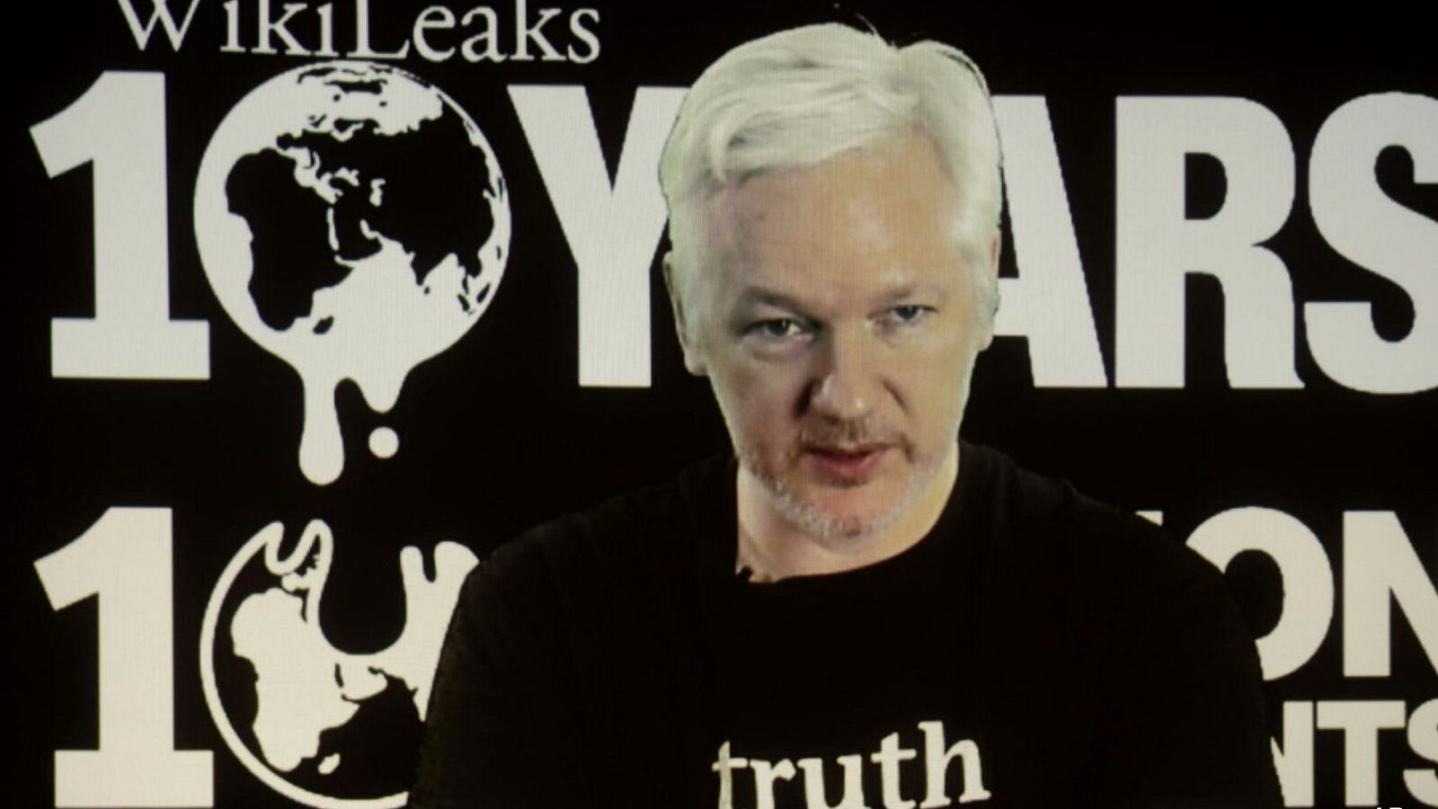 WikiLeaks founder Julian Assange participates via video link at a news conference marking the 10th anniversary of the secrecy-spilling group in Berlin. WikiLeaks said on Monday, Oct. 17, 2016, that Assange's internet access has been cut by an unidentified state actor.
