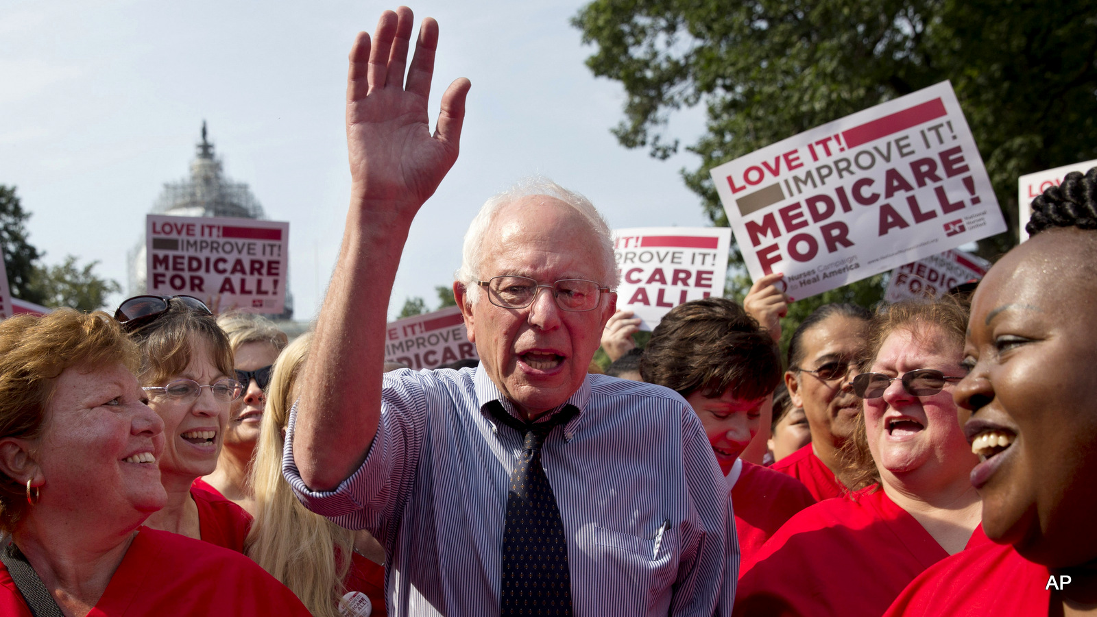 Sen. Bernie Sanders, I-Vt., waves after speaking at a rally with registered nurses and other community leaders celebrate the 50th anniversary of Medicare and Medicaid, on Capitol Hill Washington.