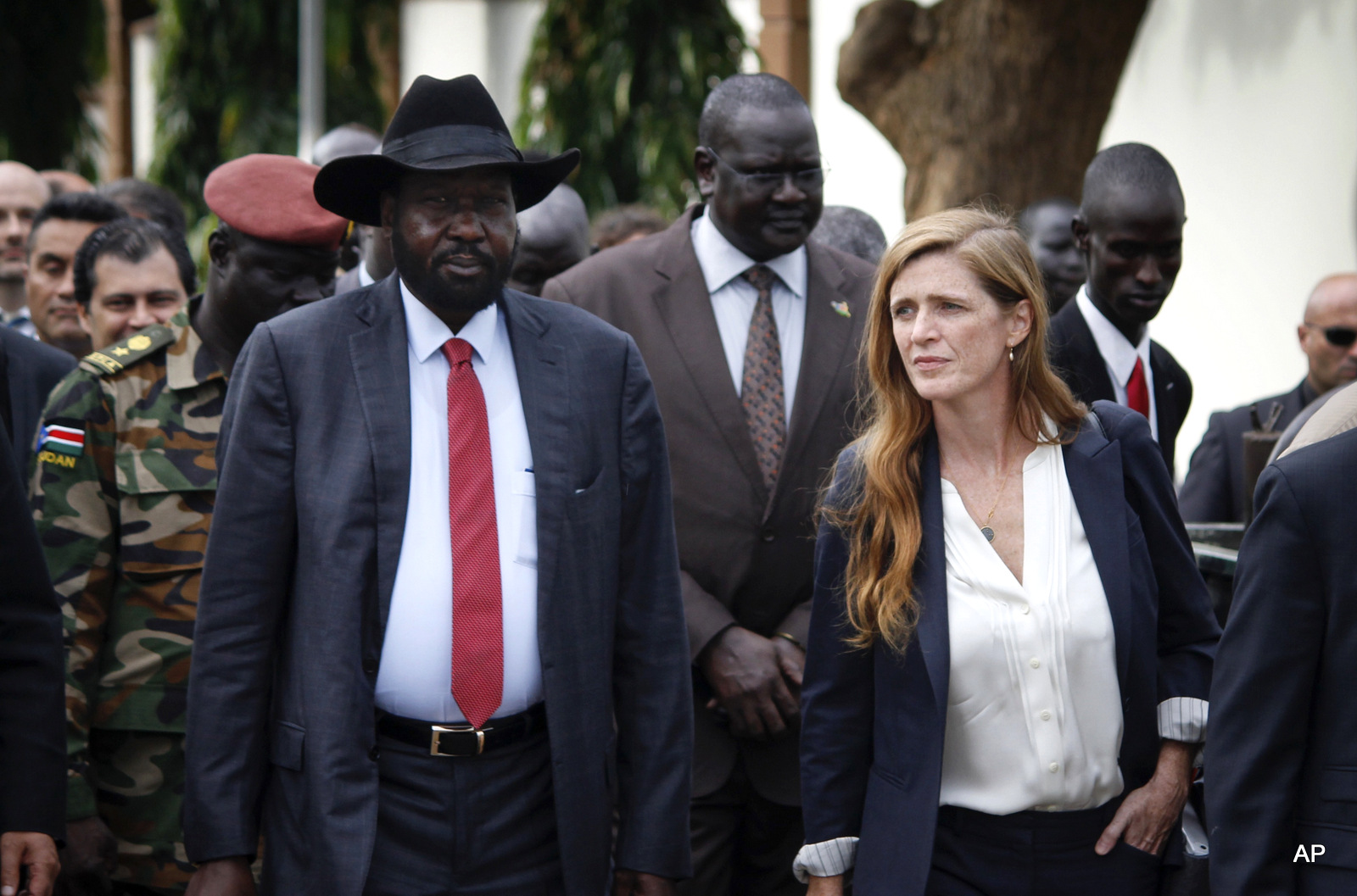 South Sudan's President Salva Kiir, left, walks with U.S. Ambassador to the United Nations Samantha Power, right, and other visiting members of the UN Security Council in the capital Juba, South Sudan, Sunday, Sept. 4, 2016. South Sudan has agreed to the deployment of a 4,000-strong regional protection force approved by the U.N. Security Council after first rejecting the peacekeepers as a violation of its sovereignty.