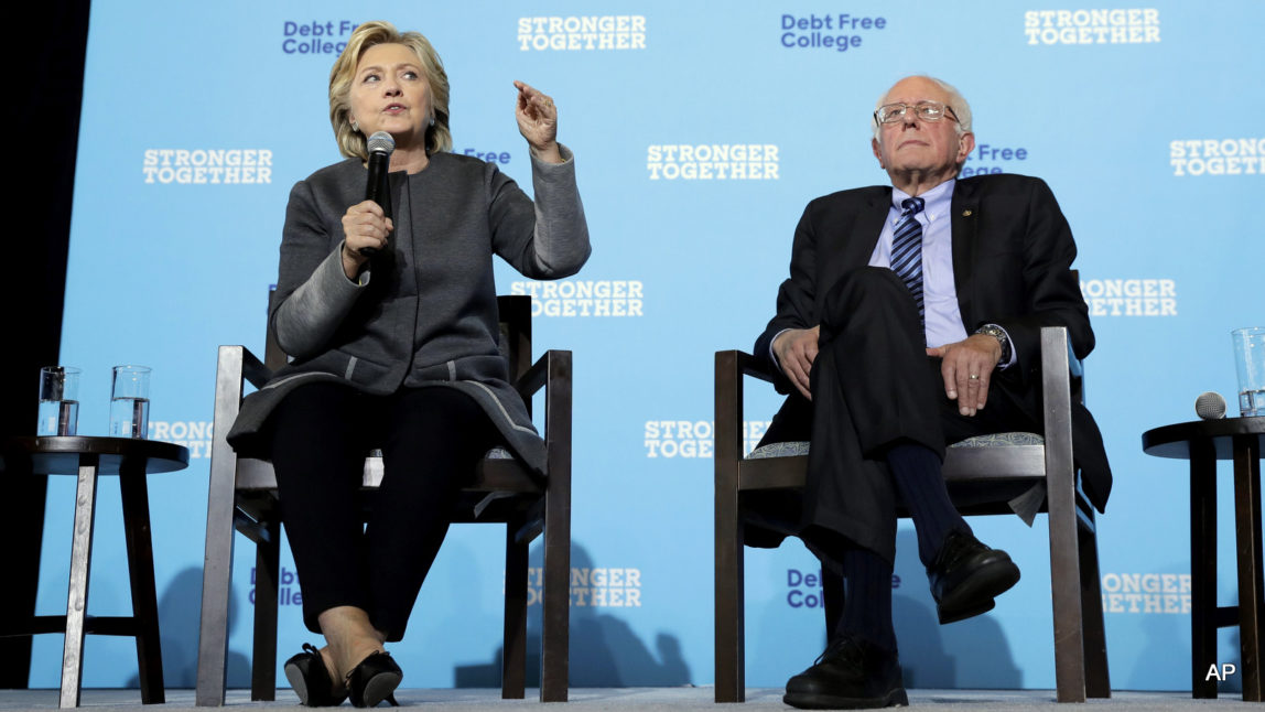 Democratic presidential candidate Hillary Clinton and Sen. Bernie Sanders, I-Vt. participate in a panel discussion during a campaign stop at the University Of New Hampshire in Durham, N.H., Wednesday, Sept. 28, 2016.