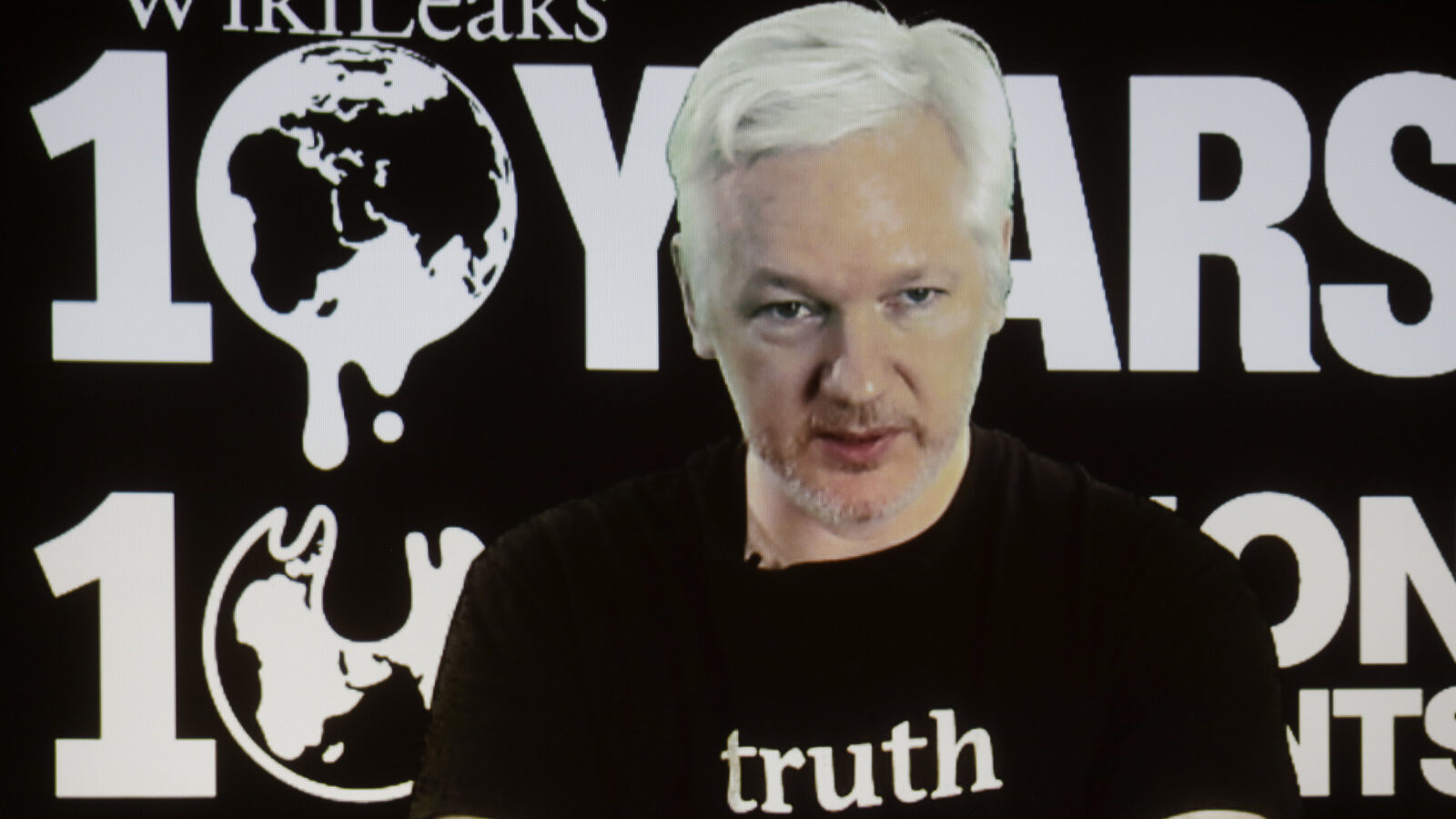 WikiLeaks founder Julian Assange participates via video link at a news conference marking the 10th anniversary of the secrecy-spilling group in Berlin, Germany, Tuesday, Oct. 4, 2016.