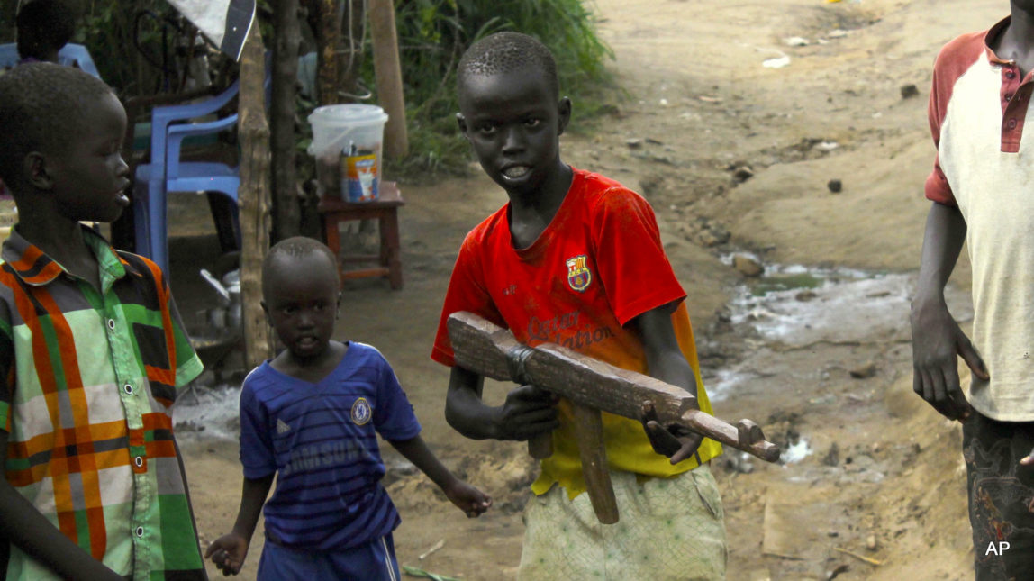 A group of children at the U.N. protection of Civilians site in Juba, South Sudan, play with a toy gun. President Barack Obama has issued waivers that continue U.S. military assistance for South Sudan and six other nations where child soldiers have been used.