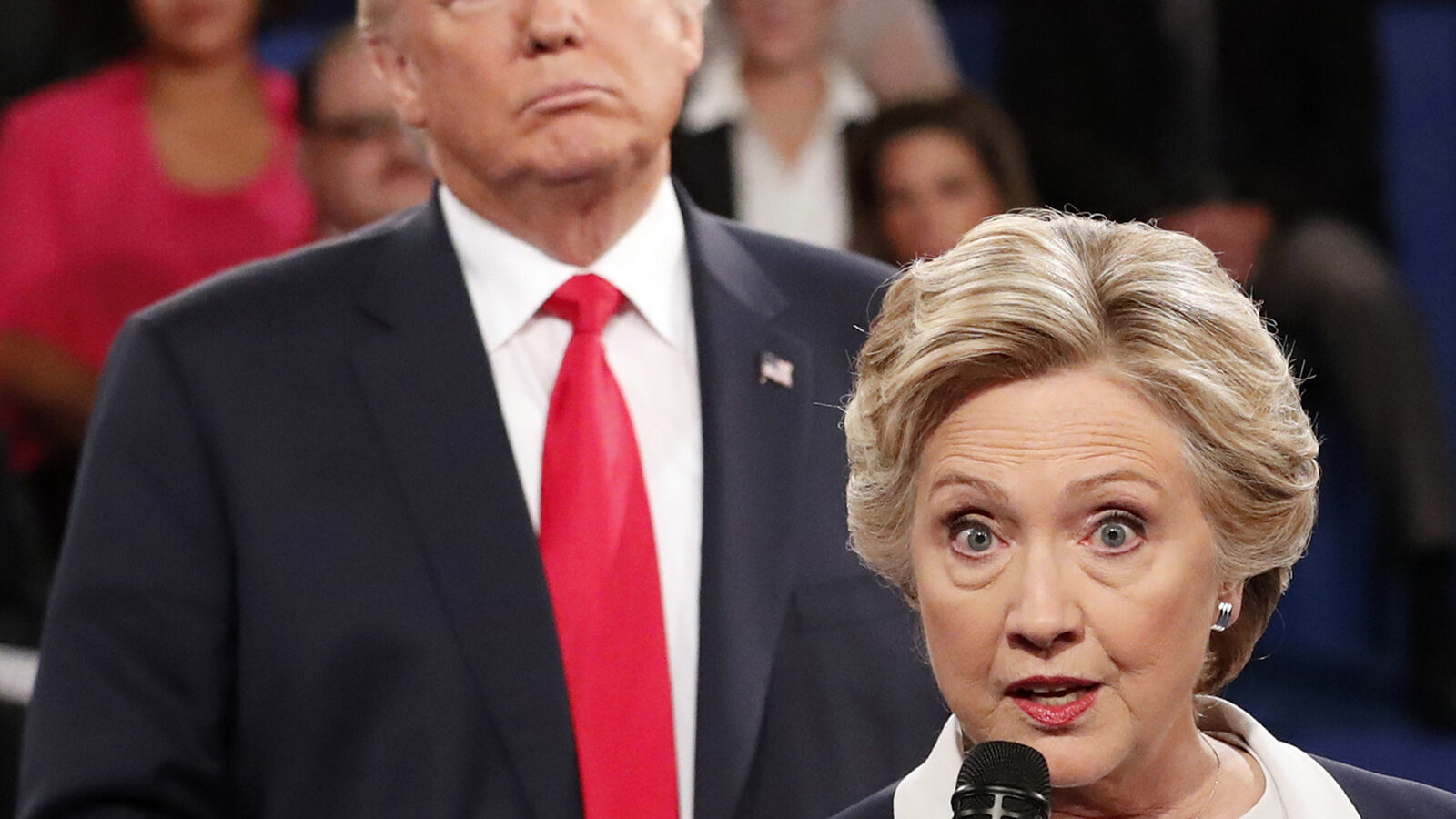 Democratic presidential nominee Hillary Clinton, right, speaks as Republican presidential nominee Donald Trump listens during the second presidential debate at Washington University in St. Louis, Sunday, Oct. 9, 2016.