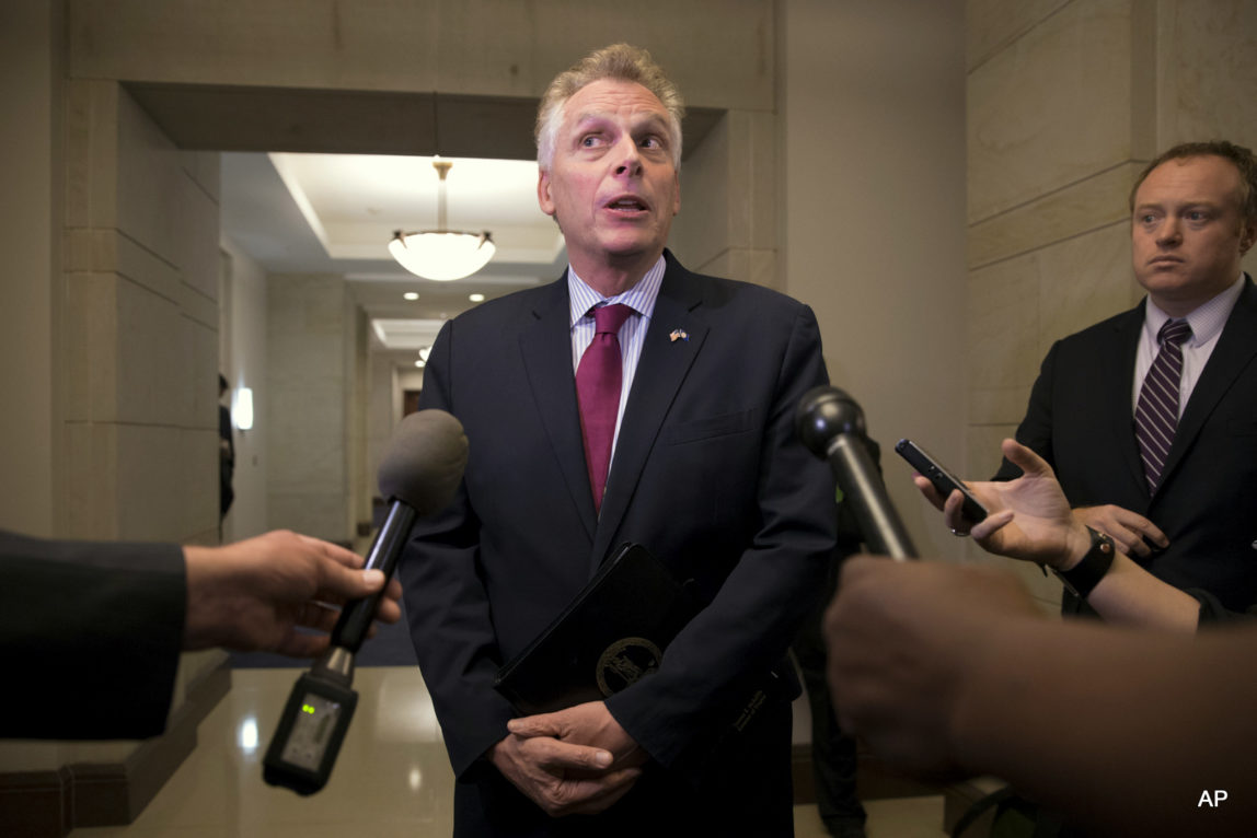Virginia Gov. Terry McAuliffe speaks with reporters on Capitol Hill in Washington. McAuliffe helped fund the failed state Senate campaign of the FBI official’s wife who later go on to clear investigate Hillary Clinton's use of a private email server.