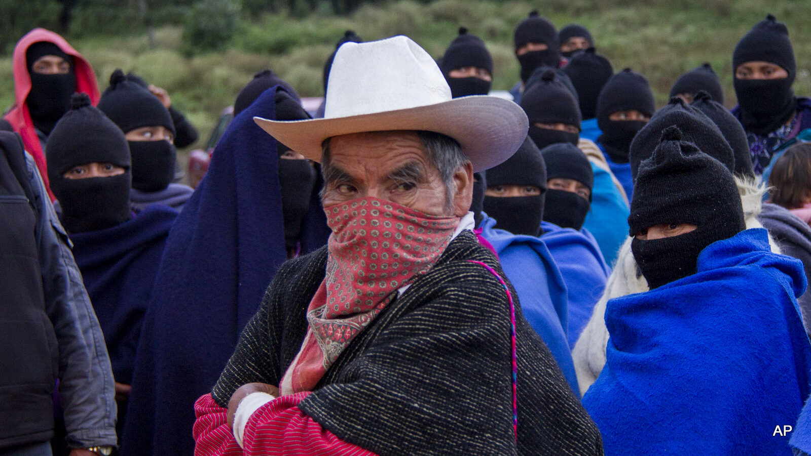 Supporters of the Zapatista National Liberation Army (EZLN) stand during a protest in support of the 43 disappeared Mexican rural college students, at a main road near San Cristobal de las Casas, Mexico, Wednesday Oct. 22, 2014.