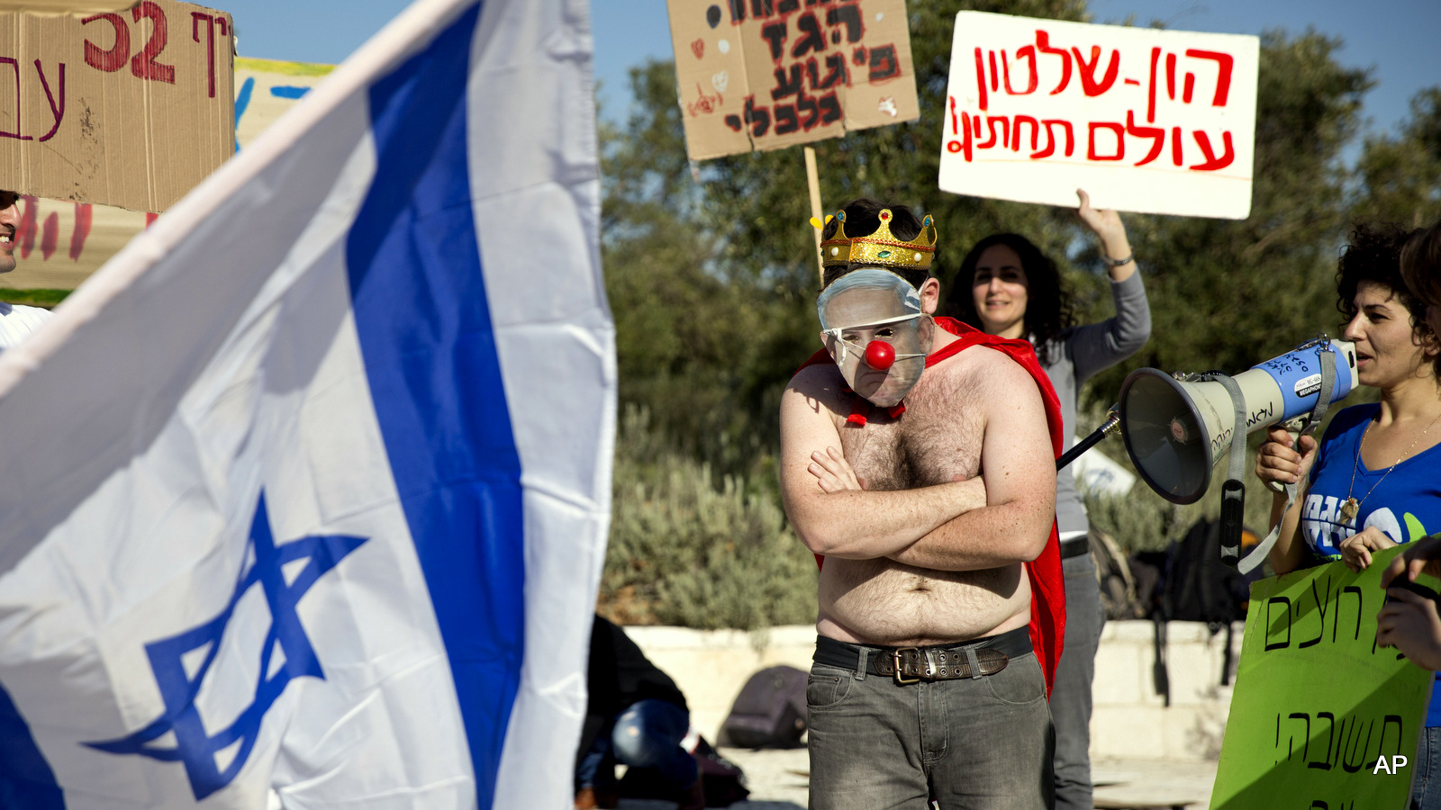 An activist wears a mask bearing a portrait of Prime Minister Benjamin Netanyahu during a protest against a natural gas deal signed in December, 2015 with U.S. and Israeli developers for drilling offshore gas deposits, in front of the Supreme Court in Jerusalem.