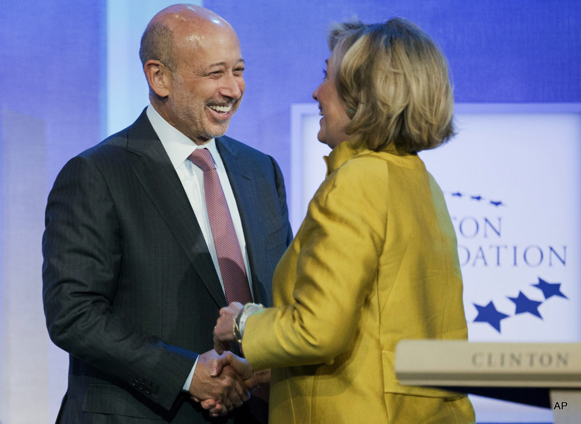 Lloyd Blankfein, CEO of Goldman Sachs, is greeted by Hillary Clinton at a panel discussion at the Clinton Global Initiative, Sept. 24, 2014 in New York.