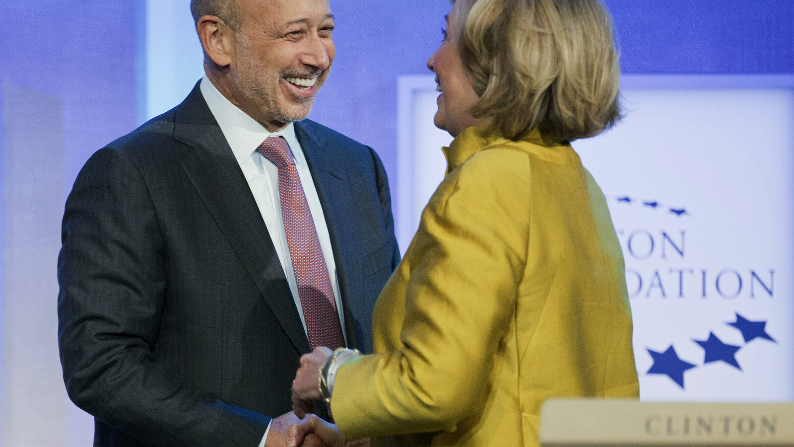 Lloyd Blankfein, CEO of Goldman Sachs, is greeted by Hillary Clinton at a panel discussion at the Clinton Global Initiative, Sept. 24, 2014 in New York.