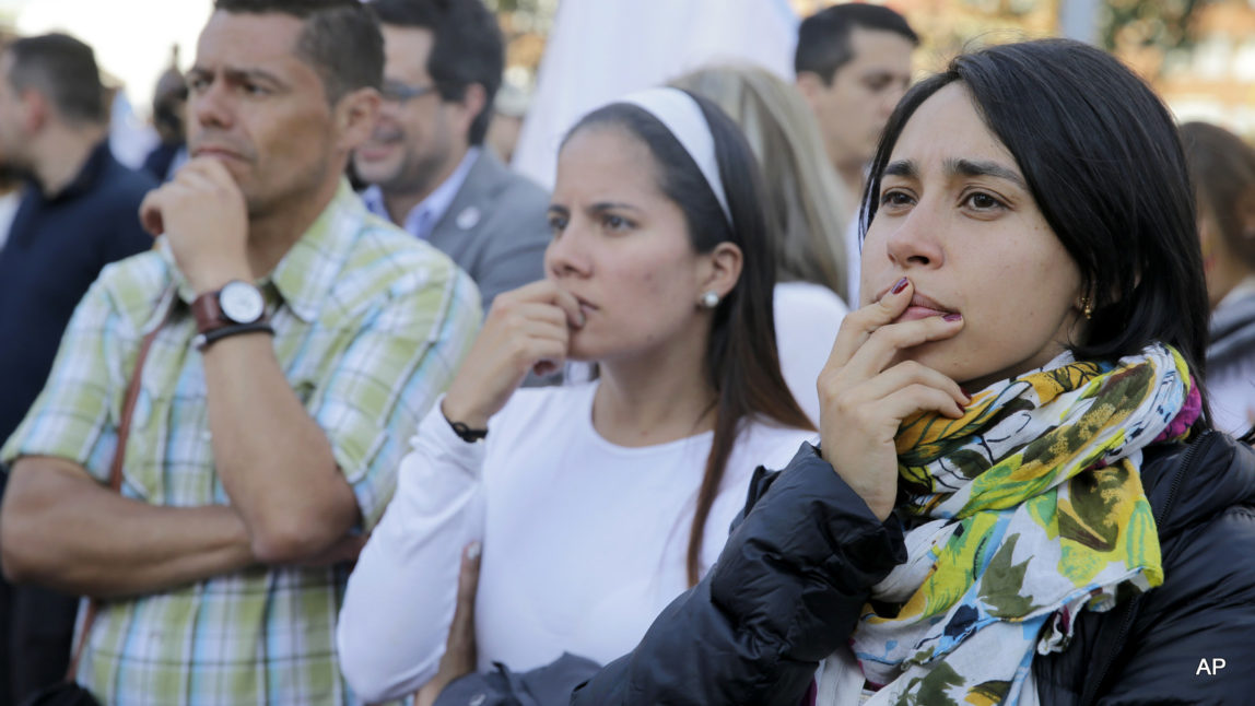 Supporters of the peace accord between the Colombian government and rebels of the Revolutionary Armed Forces of Colombia, FARC, follow on a giant screen the results of a referendum to decide whether or not to support the peace accord in Bogota, Colombia, Sunday, Oct. 2, 2016.