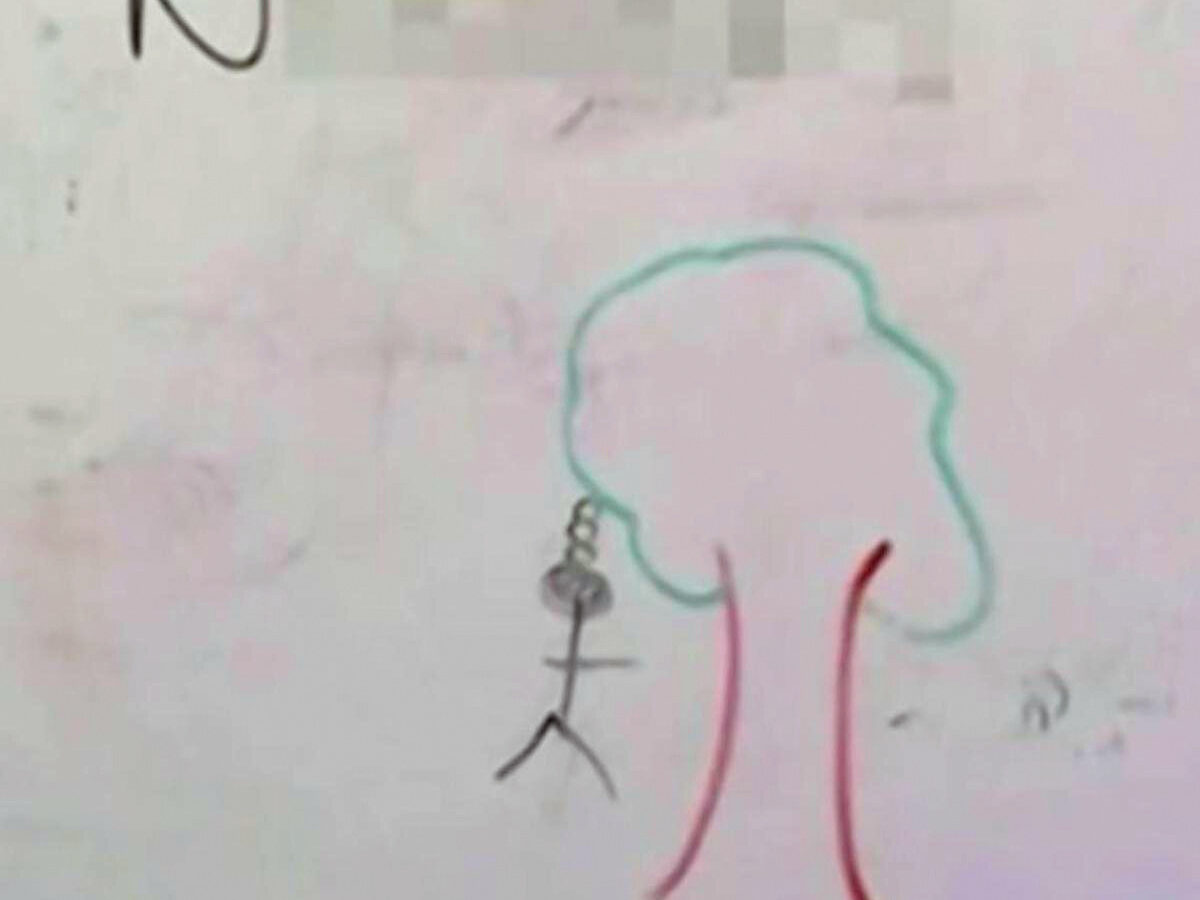 The message on the whiteboard read, “Kill N-----s,” along with a drawing of a stick figure hanging from a tree with a rope around its neck.