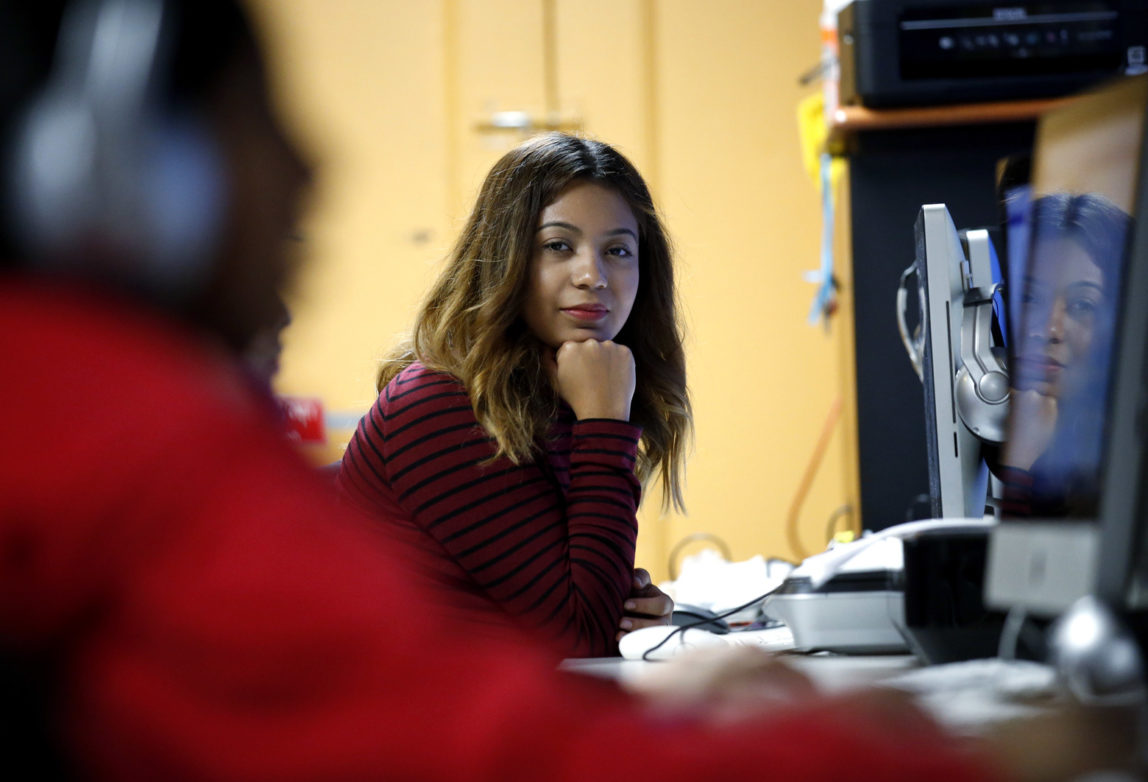 Andrea Aguilera sits at the Erie Neighborhood House in Chicago, Thursday, Nov. 17, 2016. Aguilera, 20, a student at a suburban Chicago college, said she feels uncertain since the election. She was brought to the country illegally as a child and has been able to get a work permit and avoid deportation through a federal program called, Deferred Action for Childhood Arrivals. She said she doesn't know what will happen next with the program. (AP Photo/Nam Y. Huh)