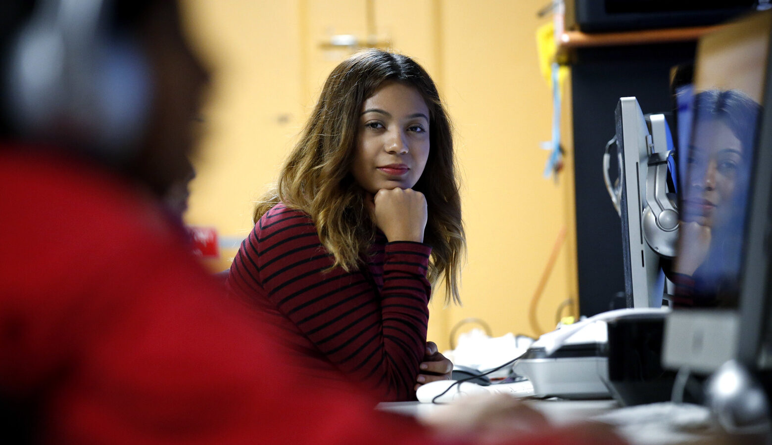 Andrea Aguilera sits at the Erie Neighborhood House in Chicago, Thursday, Nov. 17, 2016. Aguilera, 20, a student at a suburban Chicago college, said she feels uncertain since the election. She was brought to the country illegally as a child and has been able to get a work permit and avoid deportation through a federal program called, Deferred Action for Childhood Arrivals. She said she doesn't know what will happen next with the program. (AP Photo/Nam Y. Huh)