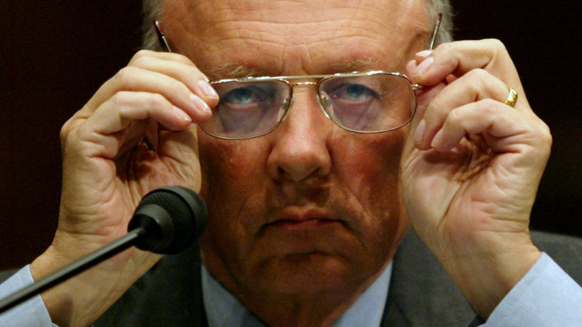 Former CIA director James Woolsey adjusts his glasses during a Senate Intelligence Committee hearing on Tuesday, July 20, 2004 in Washington. (AP Photo/Evan Vucci)