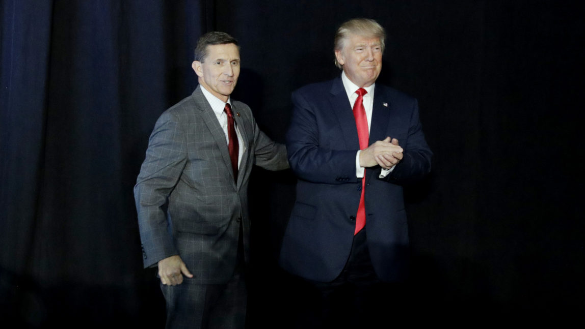 Retired Gen. Michael Flynn, left, introduces Republican presidential candidate Donald Trump at a campaign rally, Thursday, Sept. 29, 2016, in Bedford, N.H. (AP Photo/John Locher)
