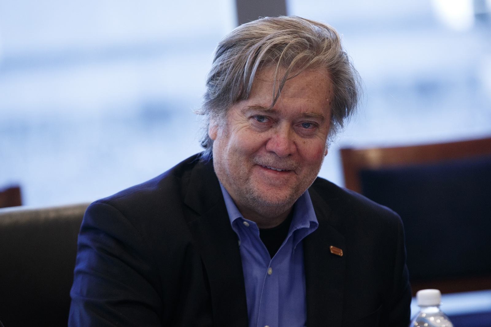 Steve Bannon, campaign CEO for Republican presidential candidate Donald Trump, right, looks on during a national security meeting with advisors at Trump Tower, Friday, Oct. 7, 2016, in New York. (AP Photo/ Evan Vucci)