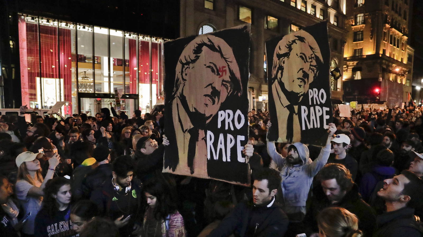 Protesters march along Fifth Avenue outside Trump Tower, Wednesday, Nov. 9, 2016, in New York, in opposition of Donald Trump's presidential election victory. (AP Photo/Julie Jacobson)
