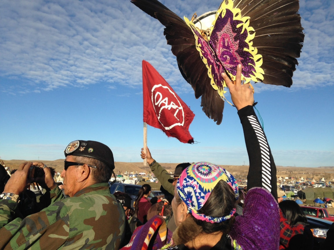 Demonstrators against the Dakota Access oil pipeline hold a ceremony at the main protest camp Tuesday, Nov. 15, 2016, near Cannon Ball, North Dakota. (AP Photo/James MacPherson)