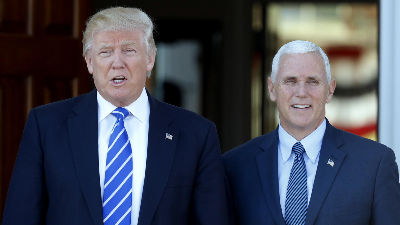 President-elect Donald Trump and Vice President-elect Mike Pence pause for photographs as they arrive at the Trump National Golf Club Bedminster clubhouse in Bedminster, N.J., Saturday, Nov. 19, 2016. (AP Photo/Carolyn Kaster)